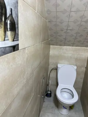 a bathroom with a white toilet in a room at MarrakLuft in Marrakech
