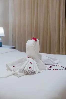 a white wedding dress sitting on a bed at Comfort, ideal location in Guéliz Marrakech in Oulad Akkou