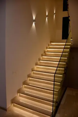 a set of stairs with lights on the wall at Villa luxueuse in Marrakech