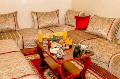 a living room with two couches and a coffee table at Emerald palace in Marrakech