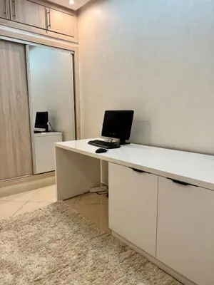 an office with a desk with a laptop on it at Modern charm in Marrakesh for a relaxing stay in Marrakech