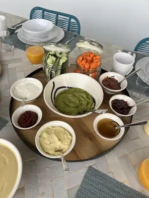 a table with a plate of food on a table at Riad Manoury Marrakech - privates Boutique-Hotel für 6 in Marrakech