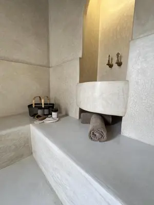 a white bathroom with a sink and a tub at Riad Manoury Marrakech - privates Boutique-Hotel für 6 in Marrakech