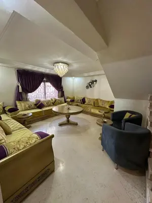 a large living room with couches and a table at Riad Arfoud Duplex Fully Equiped in Marrakech