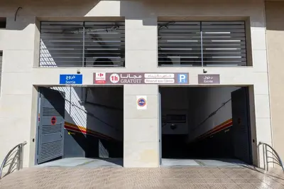 a building with a tunnel with a train in it at Moderne appart Gueliz 3 ch parking Carrefour in Marrakech