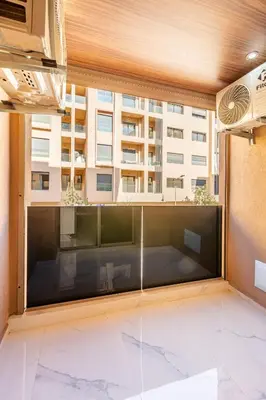 a large window with a view of a building at comfortable equipped apartment in Marrakech
