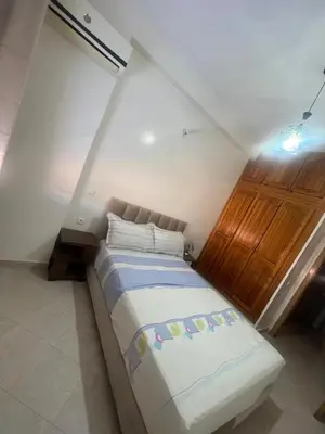 a bedroom with a large bed in a room at Appartement Marrakech in Marrakech