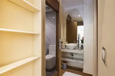 a bathroom with a toilet and a sink at Luxurious duplex with a private pool in Marrakech