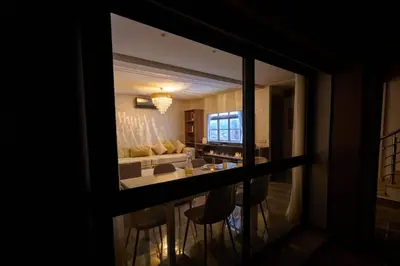 a view of a living room from a window at Luxurious duplex with a private pool in Marrakech