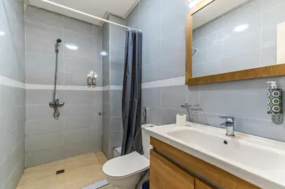 a bathroom with a toilet and a sink and a shower at Massira Social Living in Marrakech