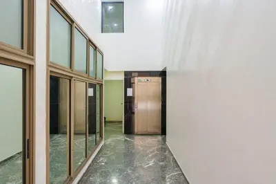 a hallway with a elevator in a building at family pool apartment in Marrakech