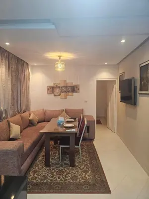 a living room with a couch and a table at the Heart of Marrakech Your Private Oasis in Marrakech