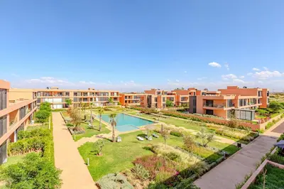an aerial view of an apartment complex with a swimming pool at Noria Golf Elegance Pool with View in Marrakech