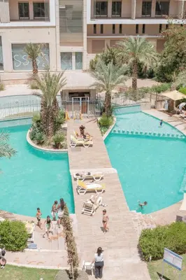 a group of people in a pool at a hotel at Beautiful Duplex Fast Wi-Fi Terrace Pool in Marrakech