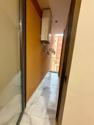 a hallway with a door leading into a room at Le Nid Hermès in Marrakech