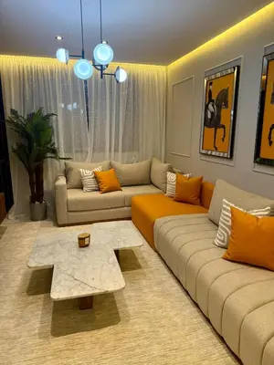a living room with a couch and a table at Le Nid Hermès in Marrakech