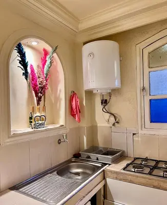 a small kitchen with a sink and a stove at Apartment in the center of Marrakesh in Marrakech