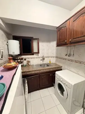 a kitchen with a washing machine and a sink at Apartment in the heart of Gueliz in Marrakech