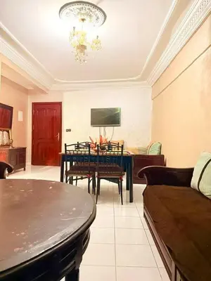 a living room with a couch and a table at Apartment in the heart of Gueliz in Marrakech
