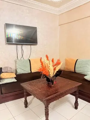 a living room with a couch and a coffee table at Apartment in the heart of Gueliz in Marrakech