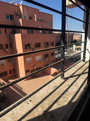 a view from the balcony of a building at Marrakech Nice Apartment- Central Marrakech in Marrakech