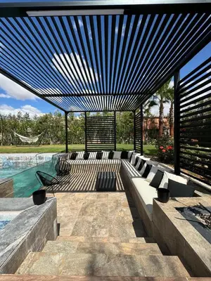 a swimming pool with a bench and a swimming pool at Villa Bora in Marrakech