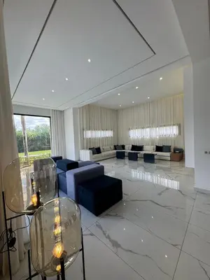 a living room with a couch and chairs in a building at Villa Bora in Marrakech