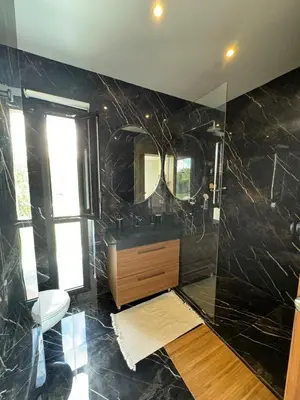 a bathroom with a sink and a mirror at Villa Bora in Marrakech