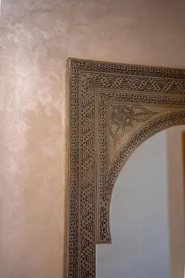an ornate door frame on a wall at Two bedroom apartment on golf resort near airport in Marrakech