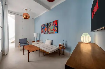 a living room with a couch and a table at Riad Byerd in Marrakech