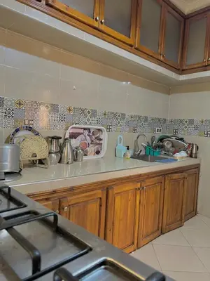 a kitchen with a sink and a counter top at Modern apartment, 10 minutes from the airport in Marrakech