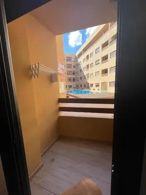 a room with a view of a building at 3wina immobilier in Marrakech