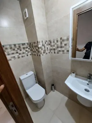 a bathroom with a toilet and a sink at 3wina immobilier in Marrakech