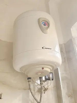 a white hair dryer in a bathroom at Appartement ECHRIFIA GARDENS in Marrakech