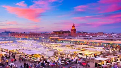a crowd of people walking around a market with tents at Appartement ECHRIFIA GARDENS in Marrakech