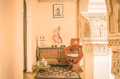 a room with a altar with a chair and a table at Riad Enchanté in Marrakech