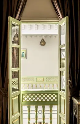 an open door to a room with a window at Riad Enchanté in Marrakech