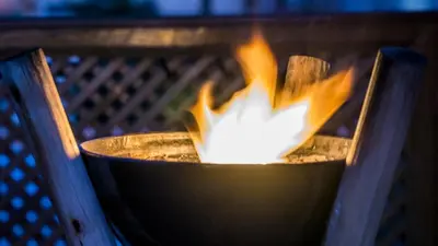 a fire in a pot with flames in it at Riad Enchanté in Marrakech