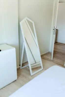 a mirror sitting on the floor next to a door at Chic et climatisé au centre de gueliz in Marrakech