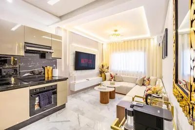 a living room with a couch and a table at Guéliz Centre-Appartement Chic près Carré Eden in Marrakech