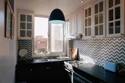 a kitchen with a sink and a stove top oven at Beldi-Chic & Moroccan Sweetness in Marrakech