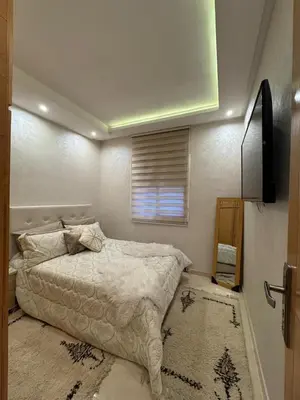 a bedroom with a bed and a window at Comfort and charm 10 min from Guéliz in Marrakech