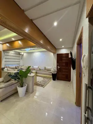 a living room with a couch and a table at Comfort and charm 10 min from Guéliz in Marrakech