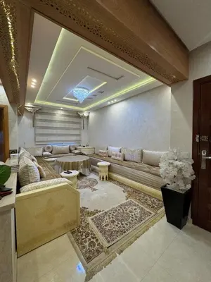 a living room with a couch and a table at Comfort and charm 10 min from Guéliz in Marrakech
