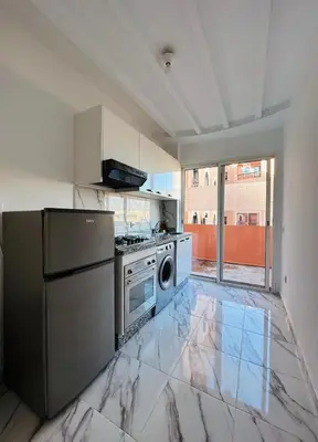 a kitchen with a stove and a dishwasher at The Pearl of Guelliz in Marrakech