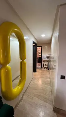a room with a yellow c alphabet on the wall at Kamal Atoumi in Marrakech