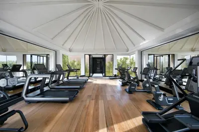 a gym with a lot of treadmills and ellipticals at Mandarin Oriental, Marrakech in Marrakech