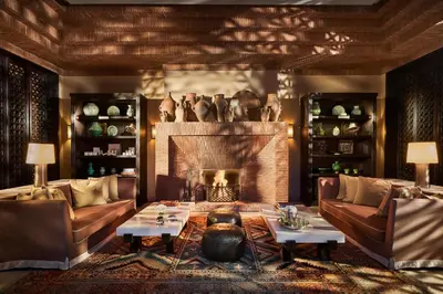 a living room with couches and a fireplace at Mandarin Oriental, Marrakech in Marrakech