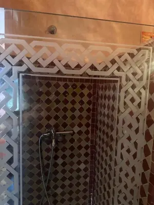 a shower with a glass door in a bathroom at Cosy villa a marrakech in Marrakech