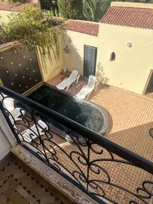a swimming pool on the roof of a house at Cosy villa a marrakech in Marrakech